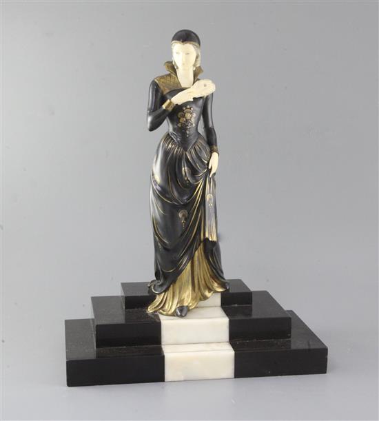 E.Menneville. A French Art Deco phenolic and bronzed spelter figure of a lady descending a staircase, LElegante, 17.5in.